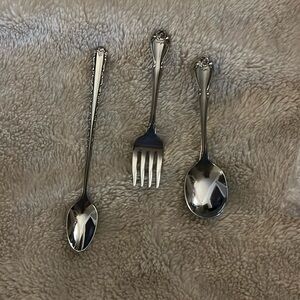 Oneida stainless steel baby flatware and Precious Moments figure